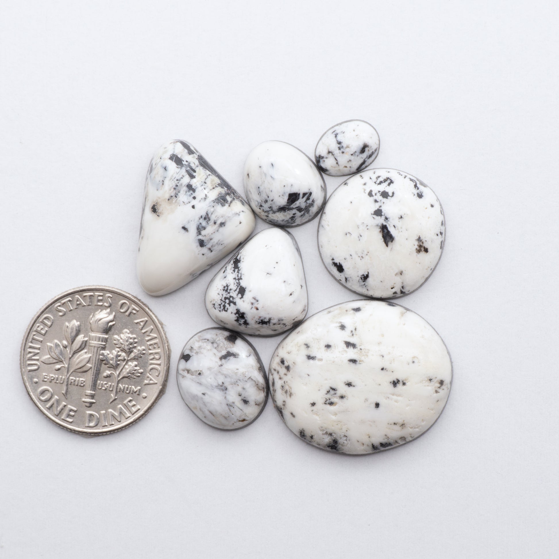 These Natural White Buffalo Stone Cabochons are semi-precious gemstones cut into shapes ideal for jewelry-making 