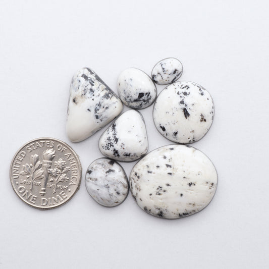 These Natural White Buffalo Stone Cabochons are semi-precious gemstones cut into shapes ideal for jewelry-making 