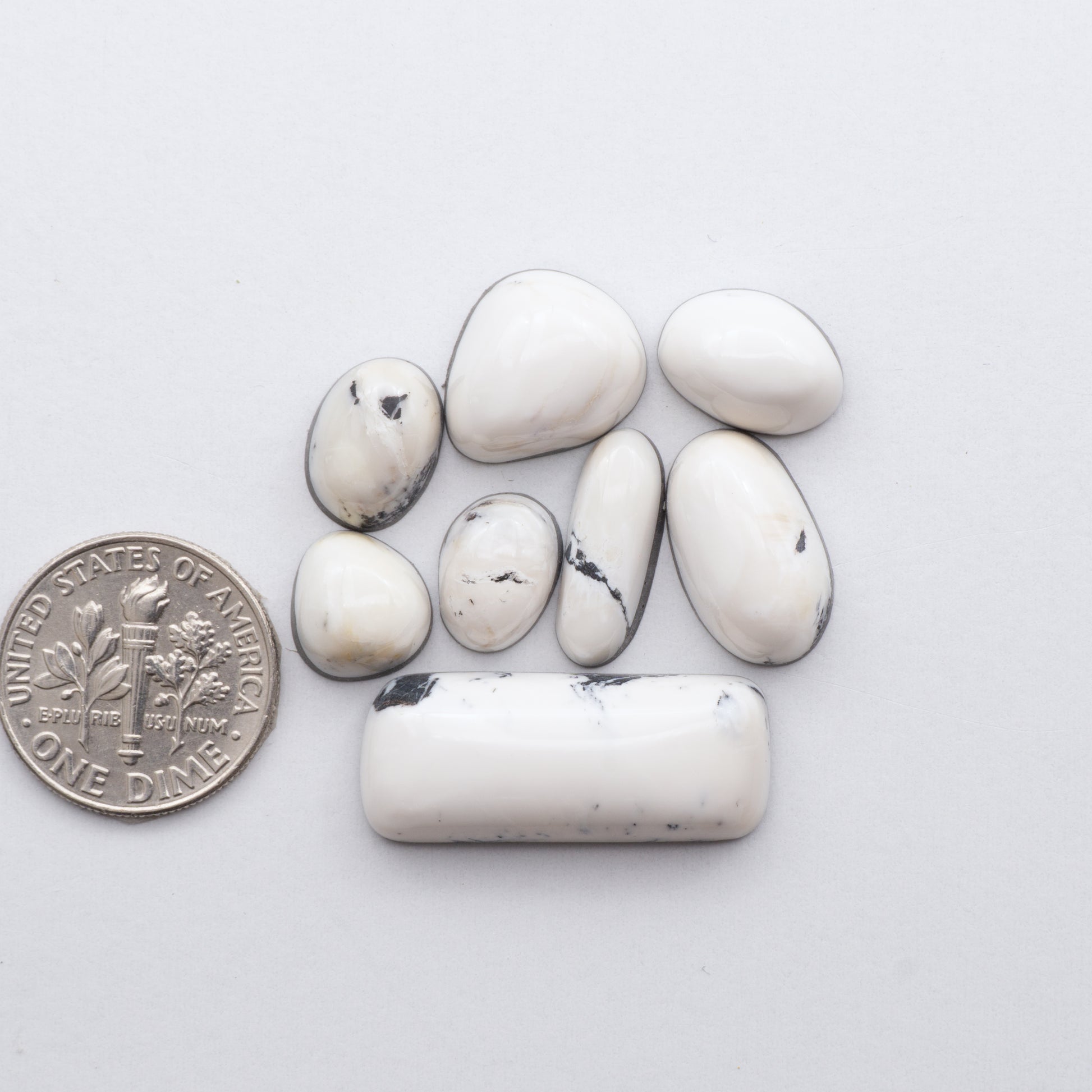 These Natural White Buffalo Stone Cabochons are semi-precious gemstones cut into shapes ideal for jewelry-making 