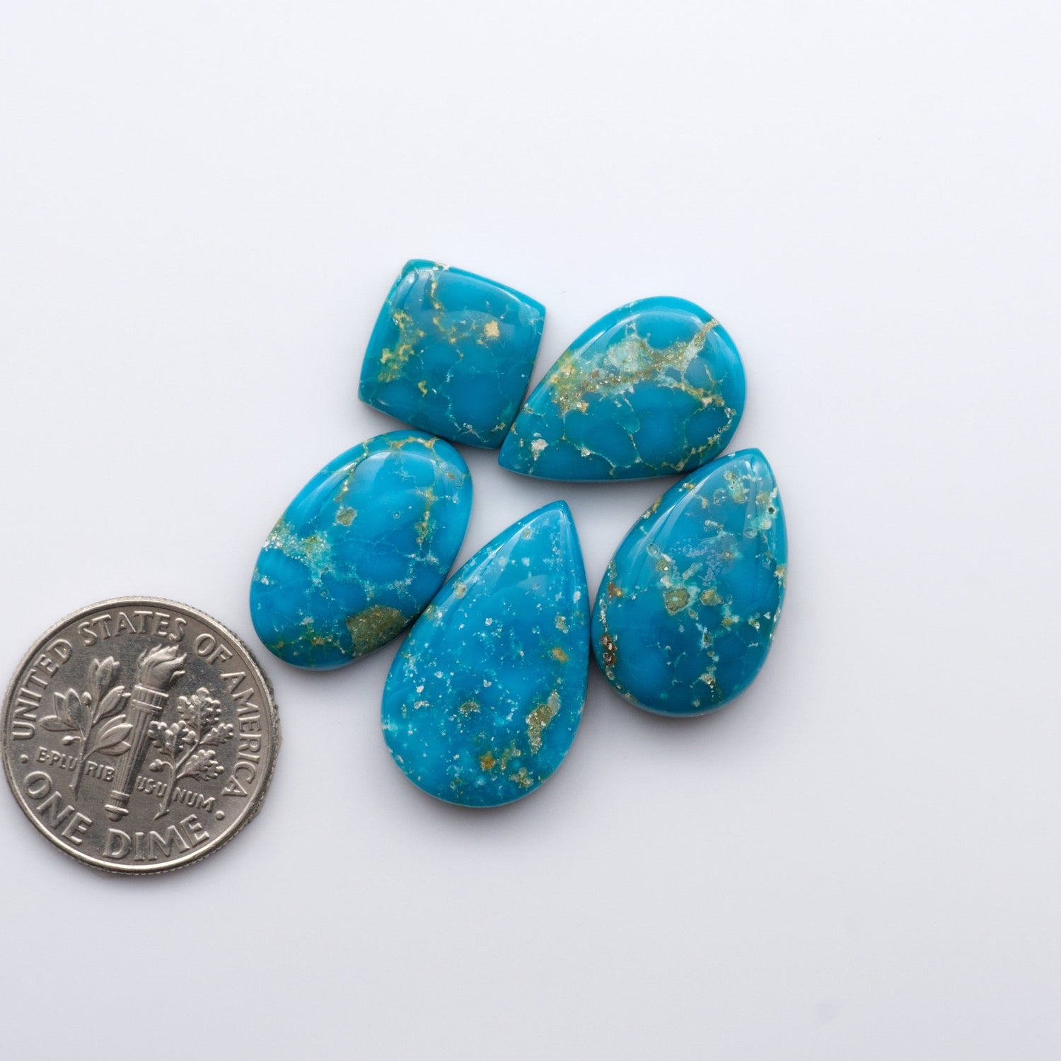 Gorgeous Sonoran South Hill Turquoise cabochons are perfect for jewelry making or collecting. Known for its stunning blue-green color and rarity, this gem will add a touch of elegance to any piece.