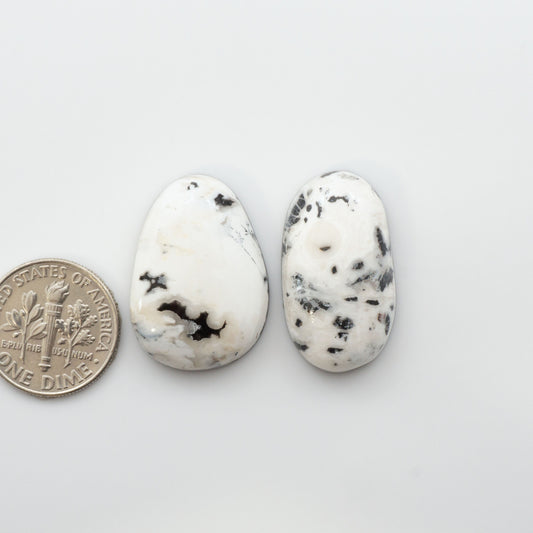 Natural White Buffalo Stone Cabochons are semi-precious gemstones cut into shapes ideal for jewelry-making, making them an excellent choice for artisans.