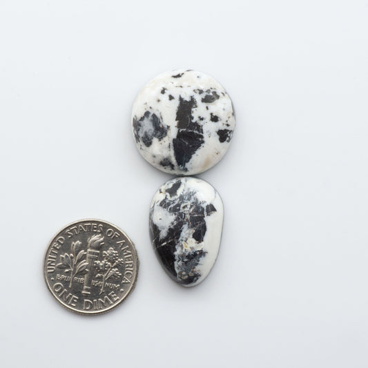 These Natural White Buffalo Stone Cabochons are semi-precious gemstones cut into shapes ideal for jewelry-making 