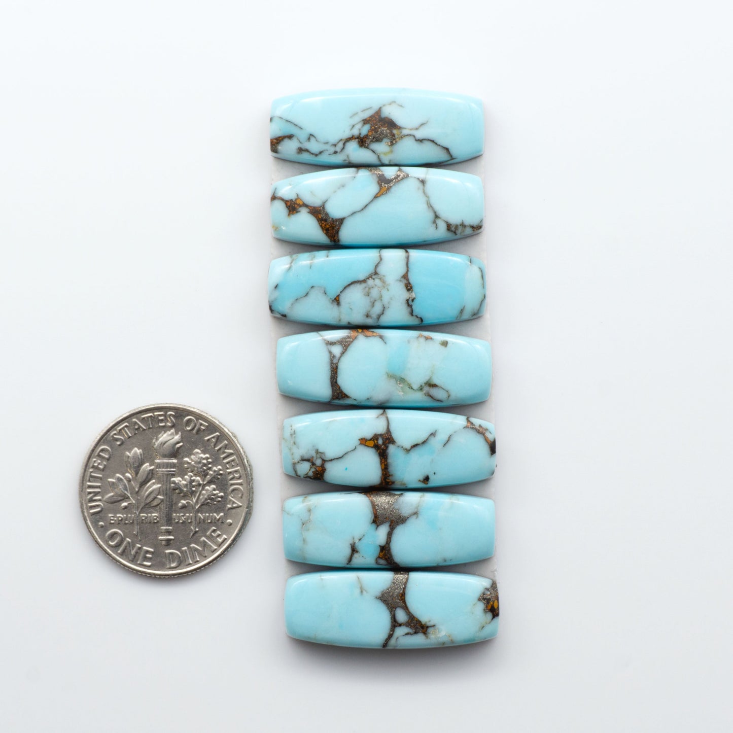 Enhance your jewelry designs with Pressed Turquoise Nugget Cabochons. Crafted from composite materials they add a captivating touch to your creations.