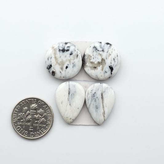 Natural White Buffalo Stone Cabochons are semi-precious gemstones cut into shapes ideal for jewelry-making, making them an excellent choice for artisans.