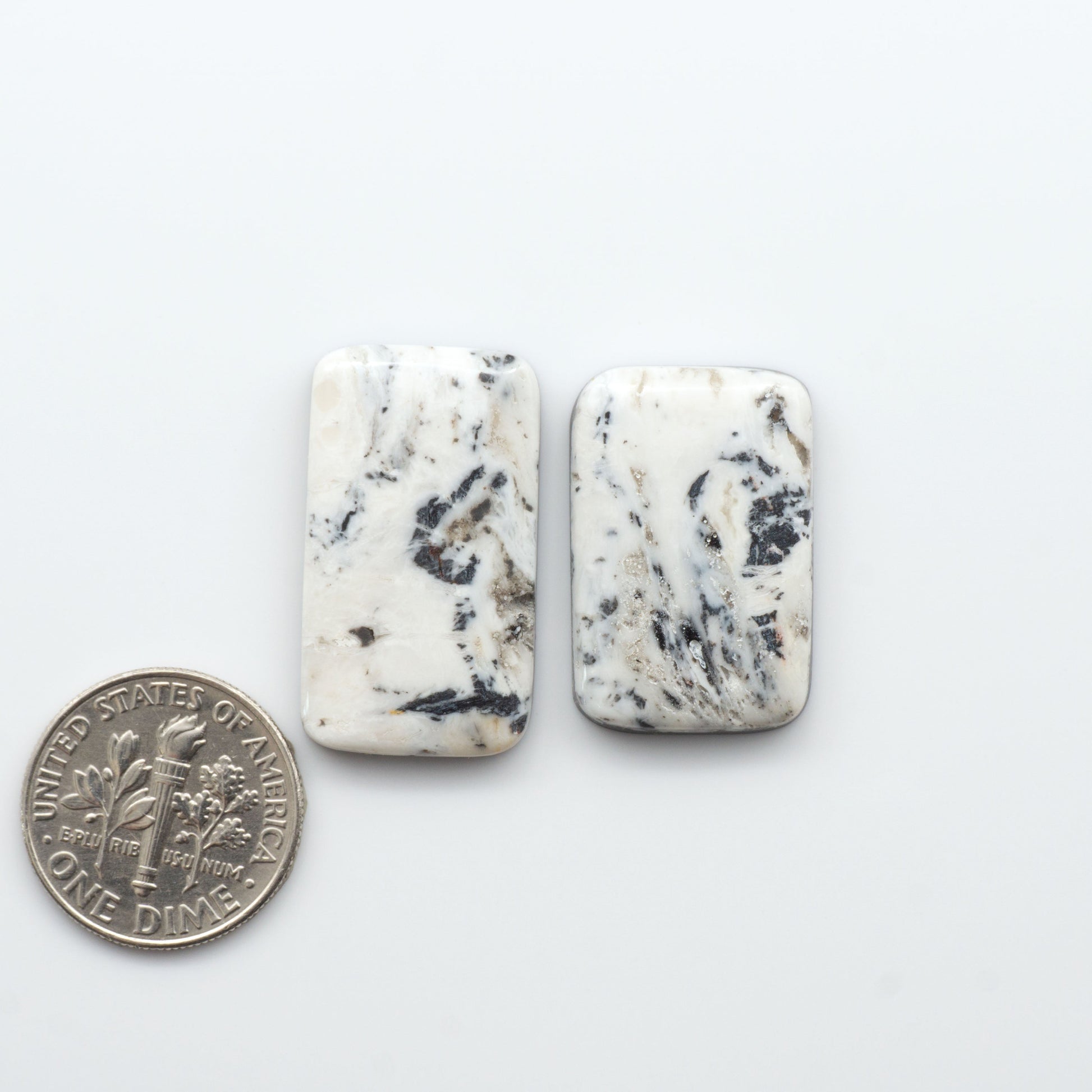 Natural White Buffalo Stone Cabochons are semi-precious gemstones cut into shapes ideal for jewelry-making, making them an excellent choice for artisans.