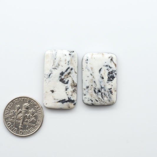 Natural White Buffalo Stone Cabochons are semi-precious gemstones cut into shapes ideal for jewelry-making, making them an excellent choice for artisans.