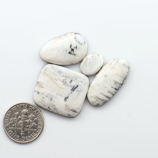 Natural White Buffalo Stone Cabochons are semi-precious gemstones cut into shapes ideal for jewelry-making, making them an excellent choice for artisans.