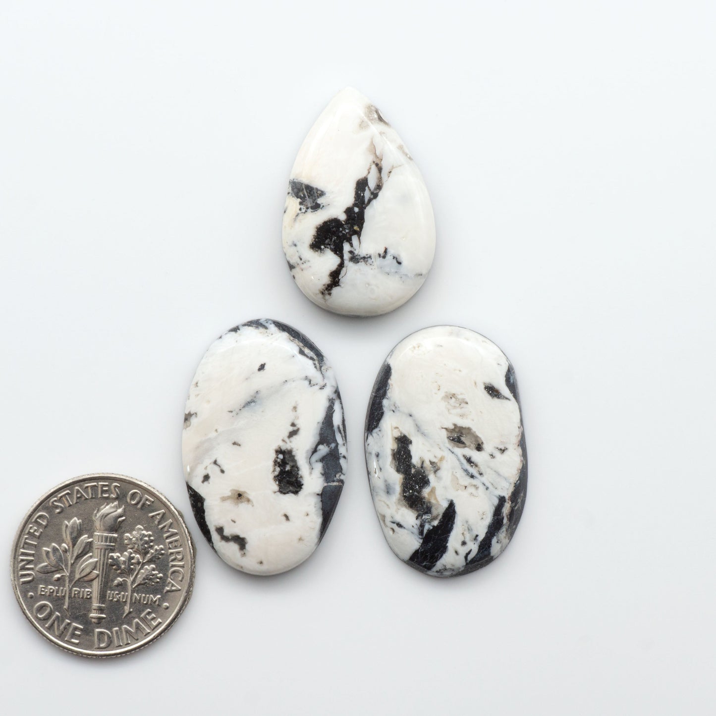 Natural White Buffalo Stone Cabochons are semi-precious gemstones cut into shapes ideal for jewelry-making, making them an excellent choice for artisans.