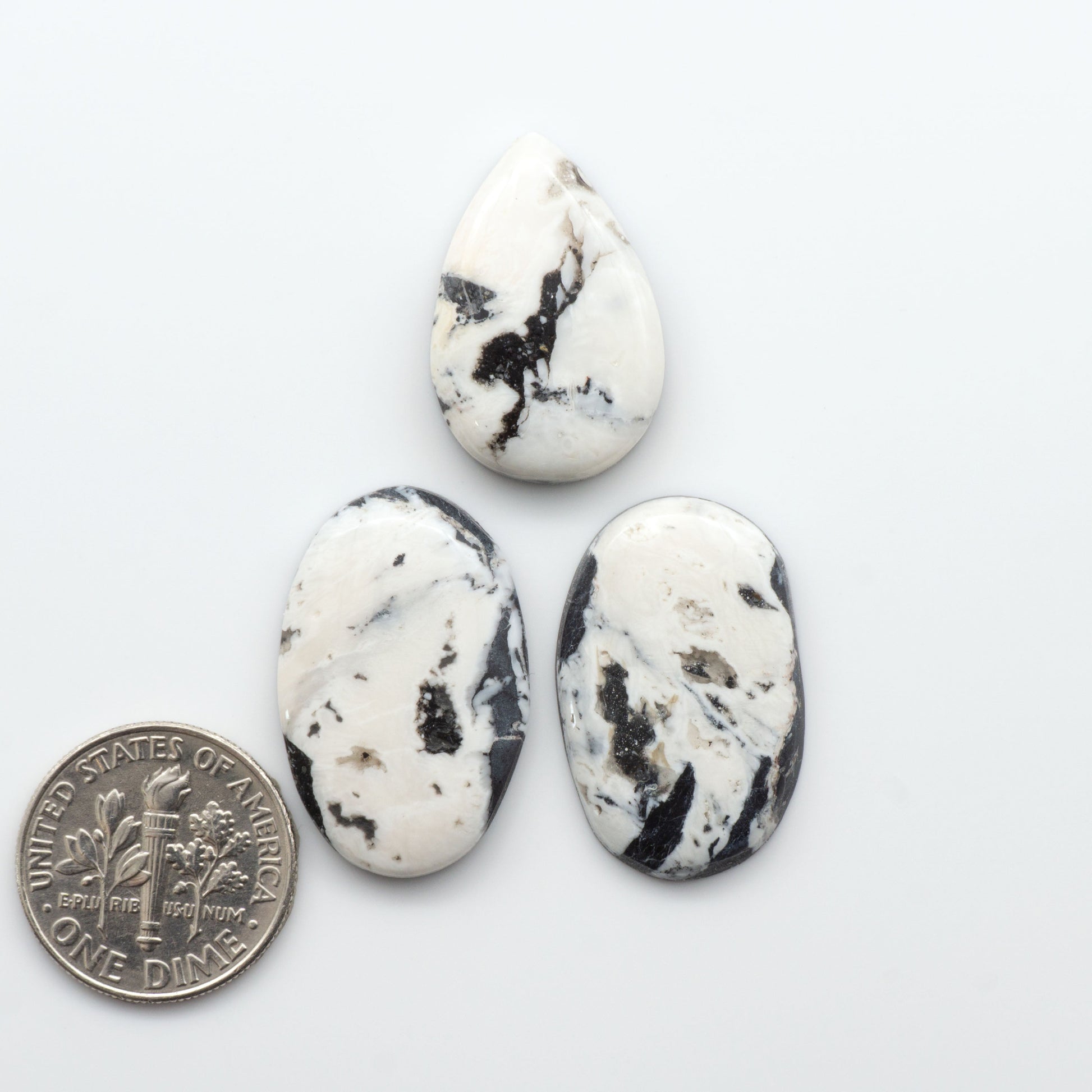 Natural White Buffalo Stone Cabochons are semi-precious gemstones cut into shapes ideal for jewelry-making, making them an excellent choice for artisans.