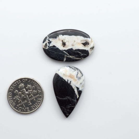 Natural White Buffalo Stone Cabochons are semi-precious gemstones cut into shapes ideal for jewelry-making, making them an excellent choice for artisans.