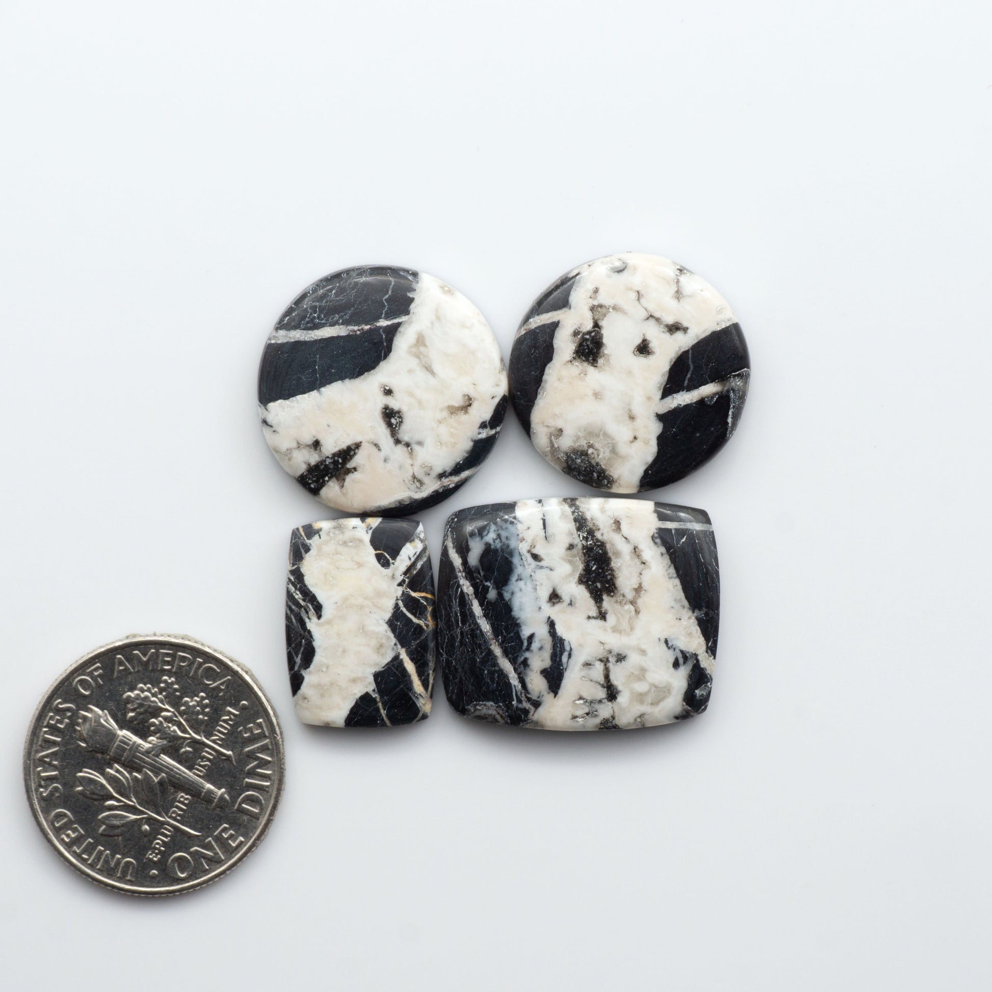 Natural White Buffalo Stone Cabochons are semi-precious gemstones cut into shapes ideal for jewelry-making, making them an excellent choice for artisans.