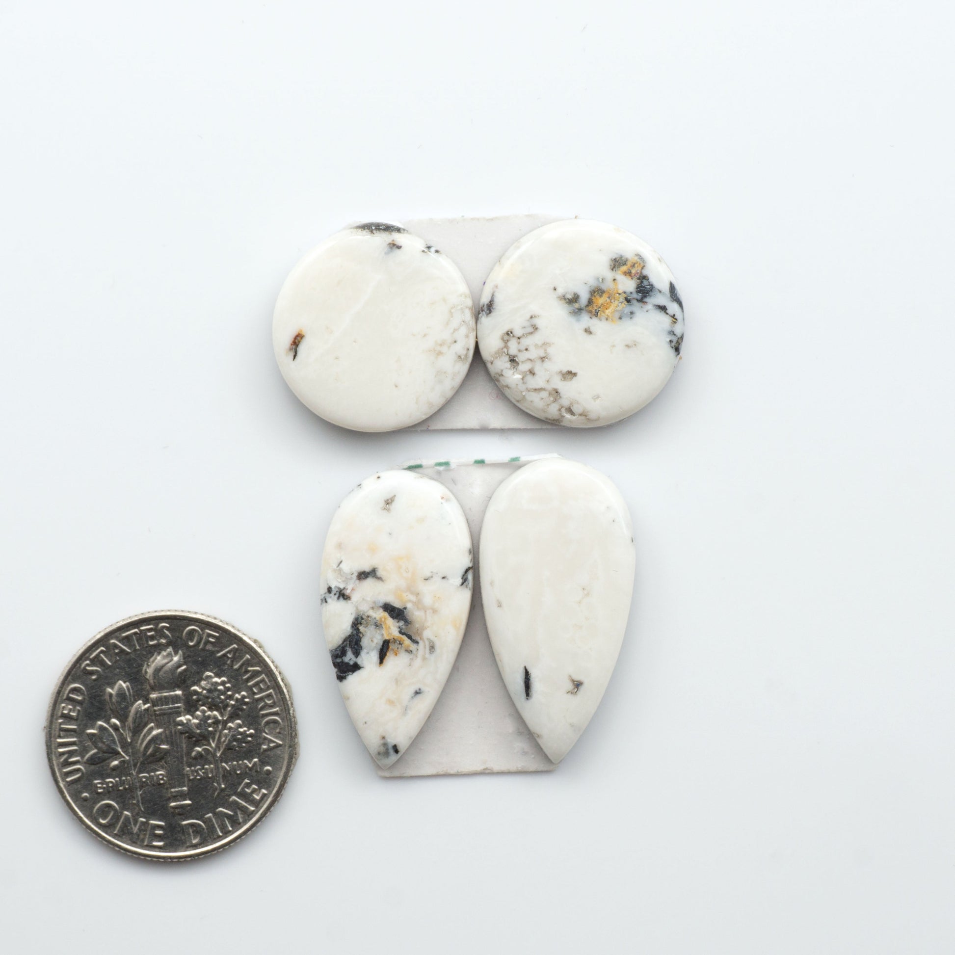Natural White Buffalo Stone Cabochons are semi-precious gemstones cut into shapes ideal for jewelry-making, making them an excellent choice for artisans.