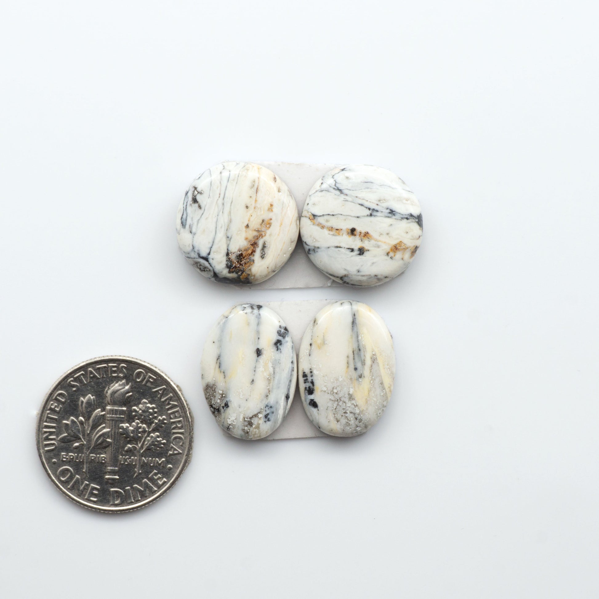 Natural White Buffalo Stone Cabochons are semi-precious gemstones cut into shapes ideal for jewelry-making, making them an excellent choice for artisans.
