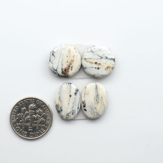 Natural White Buffalo Stone Cabochons are semi-precious gemstones cut into shapes ideal for jewelry-making, making them an excellent choice for artisans.