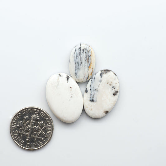 Natural White Buffalo Stone Cabochons are semi-precious gemstones cut into shapes ideal for jewelry-making, making them an excellent choice for artisans.