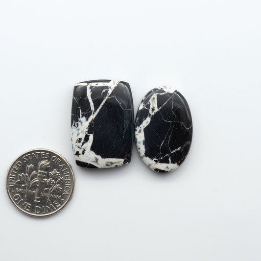 Natural White Buffalo Stone Cabochons are semi-precious gemstones cut into shapes ideal for jewelry-making, making them an excellent choice for artisans.