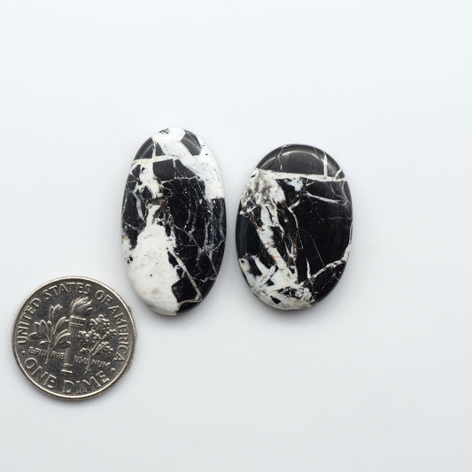 Natural White Buffalo Stone Cabochons are semi-precious gemstones cut into shapes ideal for jewelry-making, making them an excellent choice for artisans.