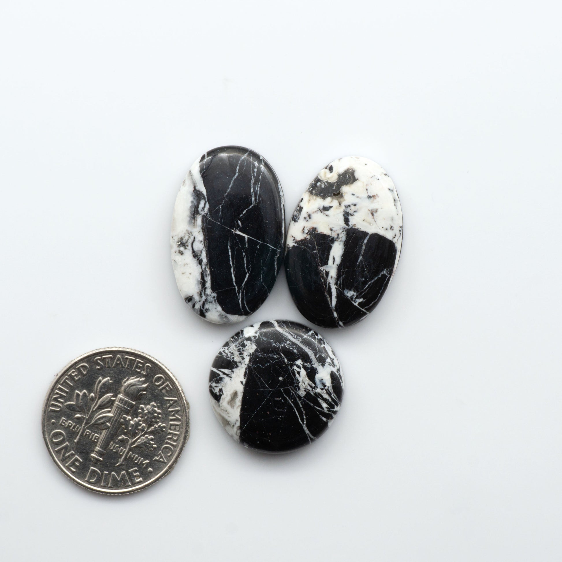 Natural White Buffalo Stone Cabochons are semi-precious gemstones cut into shapes ideal for jewelry-making, making them an excellent choice for artisans.