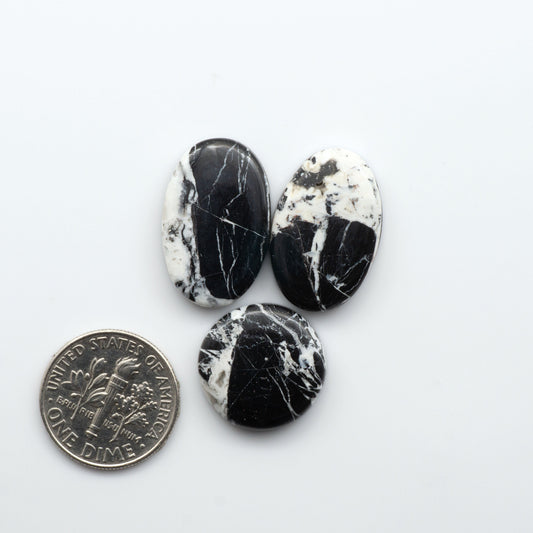 Natural White Buffalo Stone Cabochons are semi-precious gemstones cut into shapes ideal for jewelry-making, making them an excellent choice for artisans.