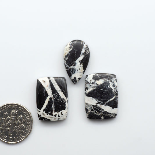Natural White Buffalo Stone Cabochons are semi-precious gemstones cut into shapes ideal for jewelry-making, making them an excellent choice for artisans.