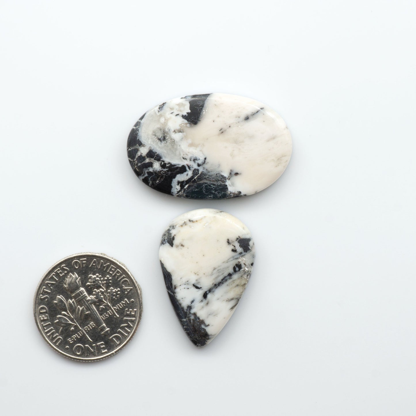 Natural White Buffalo Stone Cabochons are semi-precious gemstones cut into shapes ideal for jewelry-making, making them an excellent choice for artisans.
