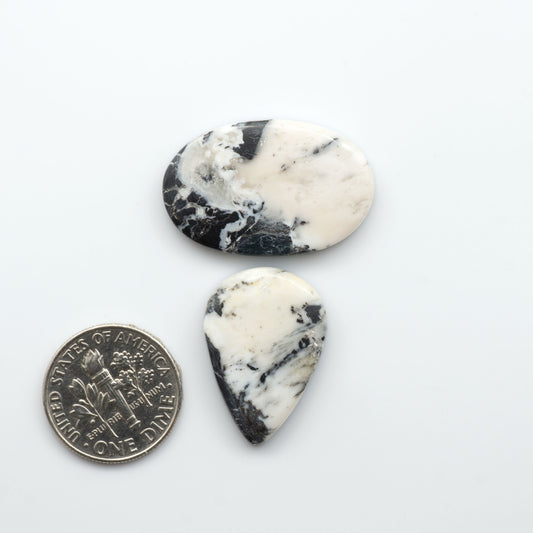 Natural White Buffalo Stone Cabochons are semi-precious gemstones cut into shapes ideal for jewelry-making, making them an excellent choice for artisans.