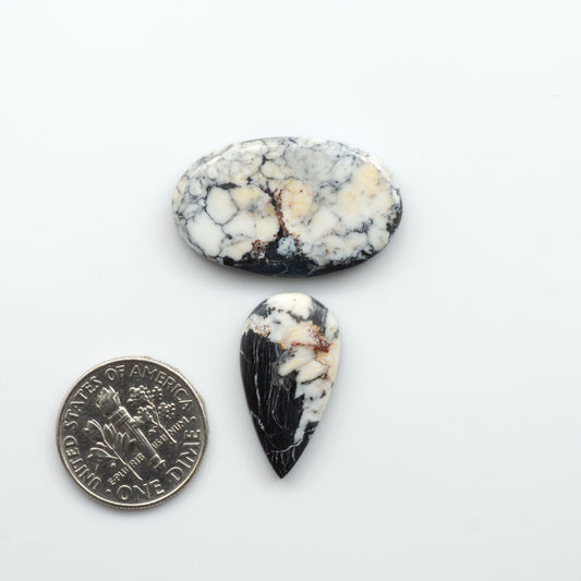 Natural White Buffalo Stone Cabochons are semi-precious gemstones cut into shapes ideal for jewelry-making, making them an excellent choice for artisans.