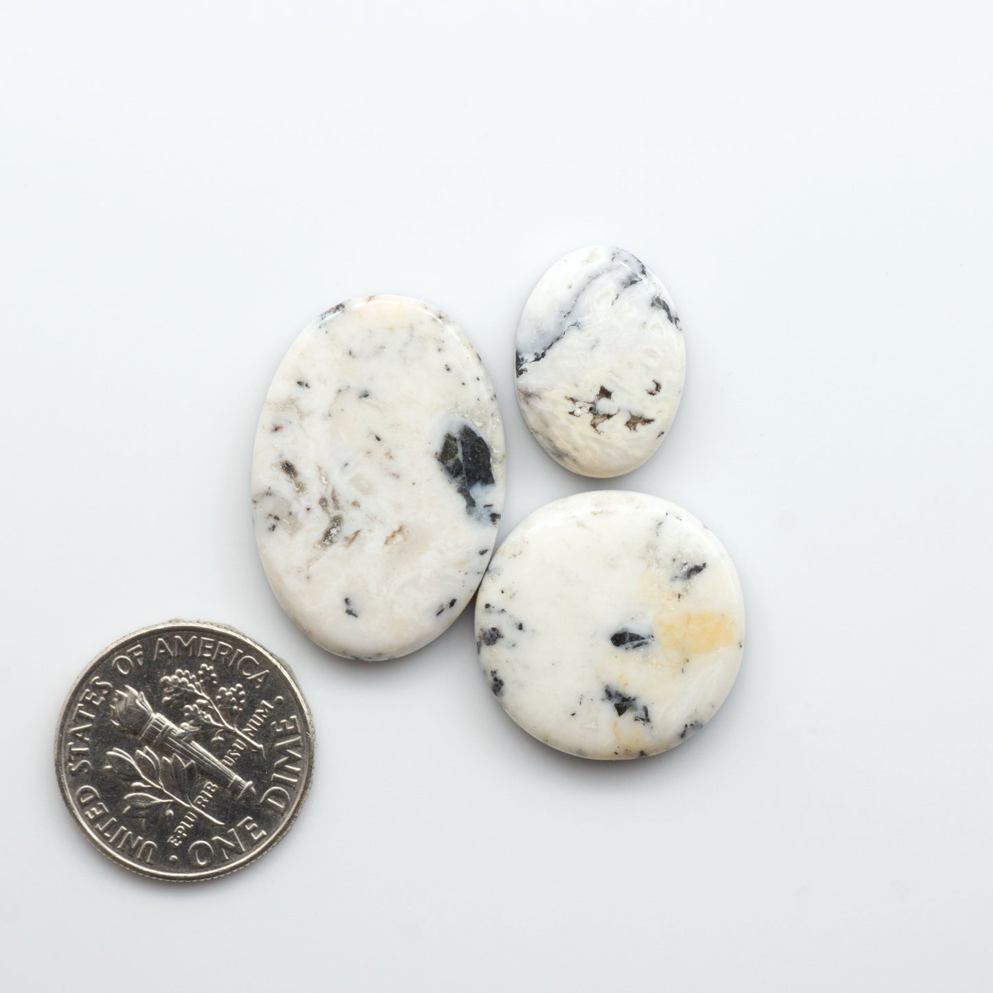 Natural White Buffalo Stone Cabochons are semi-precious gemstones cut into shapes ideal for jewelry-making, making them an excellent choice for artisans.