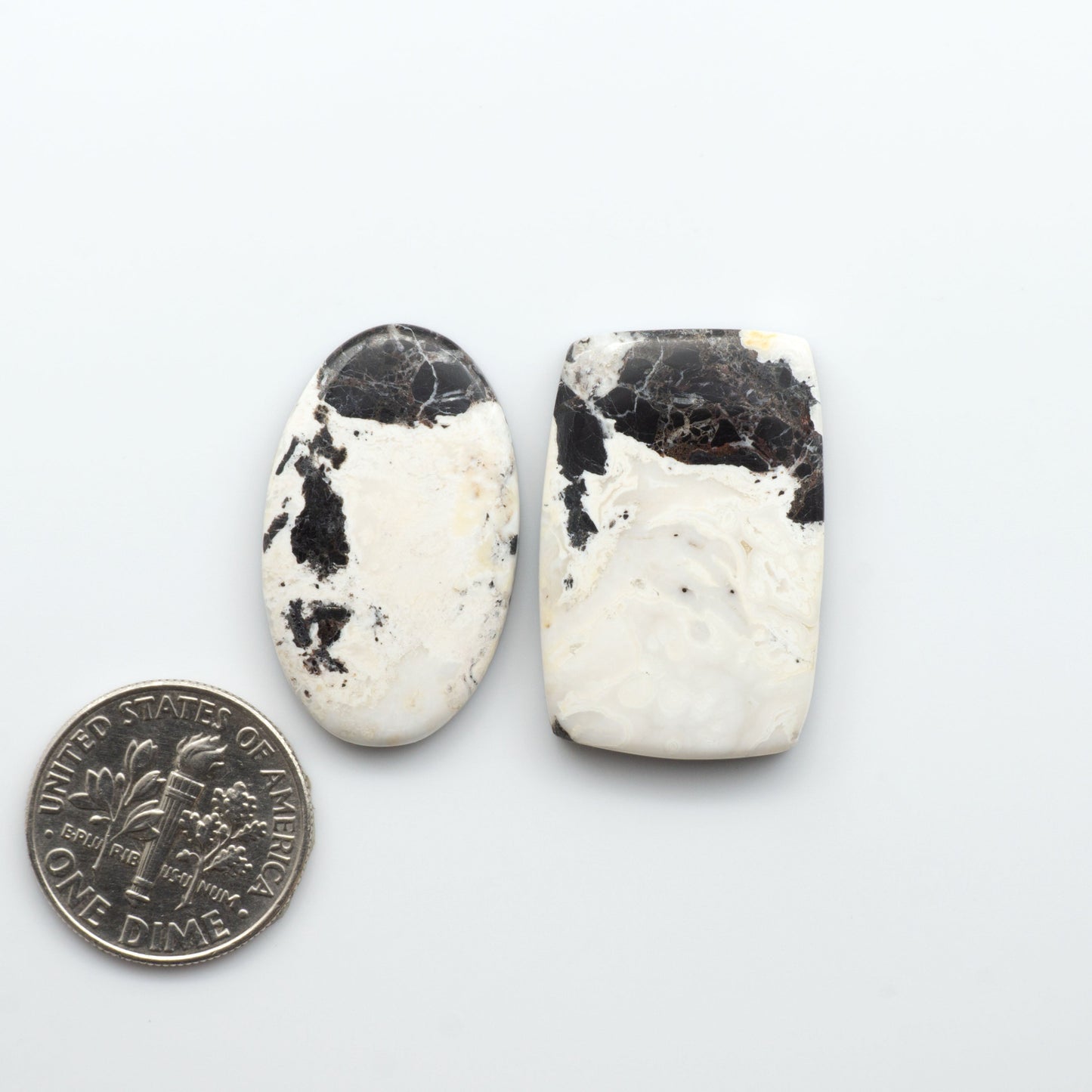 Natural White Buffalo Stone Cabochons are semi-precious gemstones cut into shapes ideal for jewelry-making, making them an excellent choice for artisans.