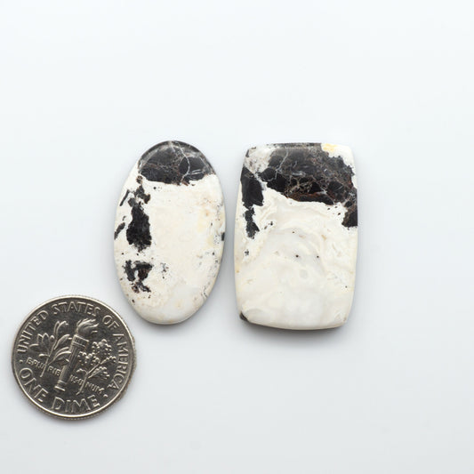 Natural White Buffalo Stone Cabochons are semi-precious gemstones cut into shapes ideal for jewelry-making, making them an excellent choice for artisans.