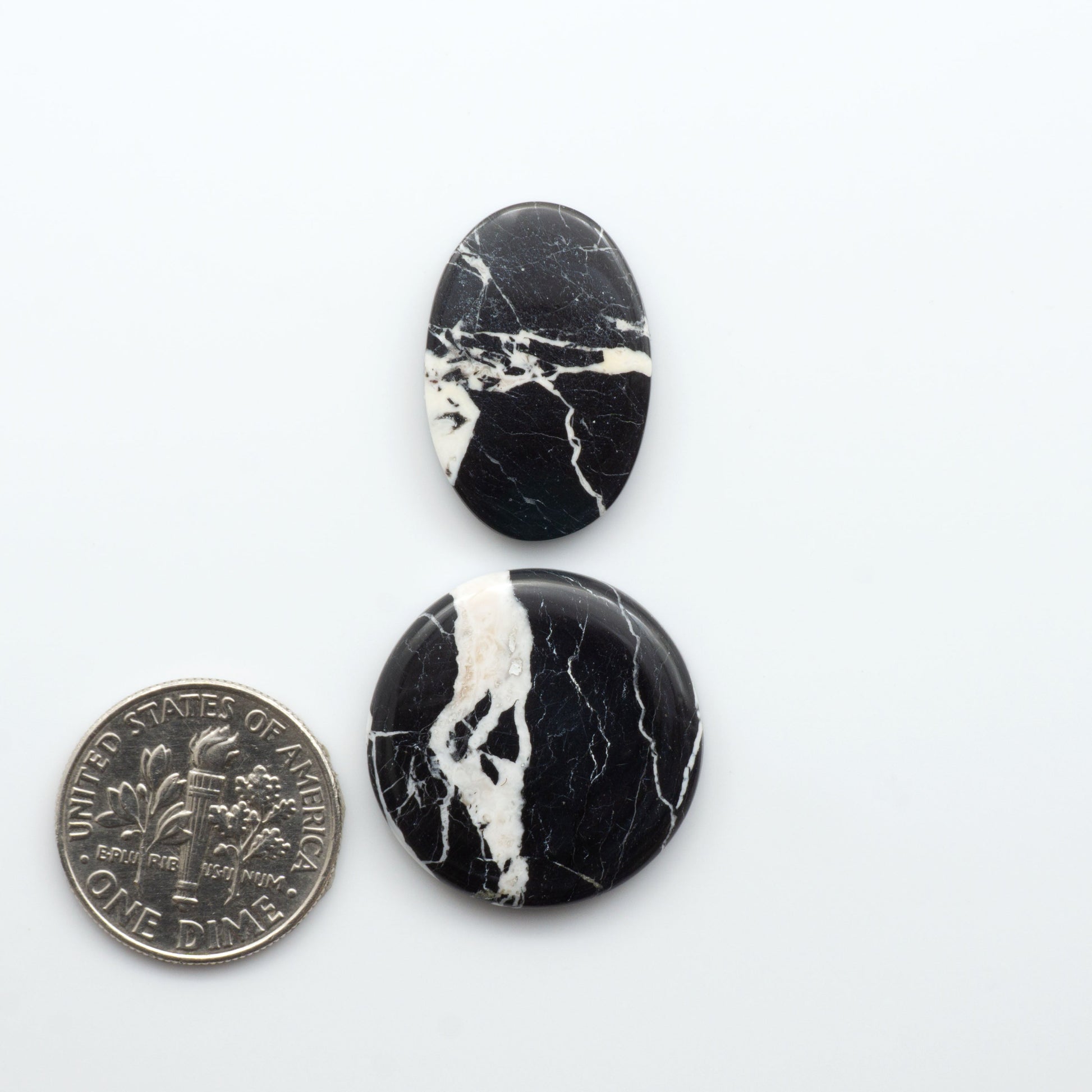 Natural White Buffalo Stone Cabochons are semi-precious gemstones cut into shapes ideal for jewelry-making, making them an excellent choice for artisans.