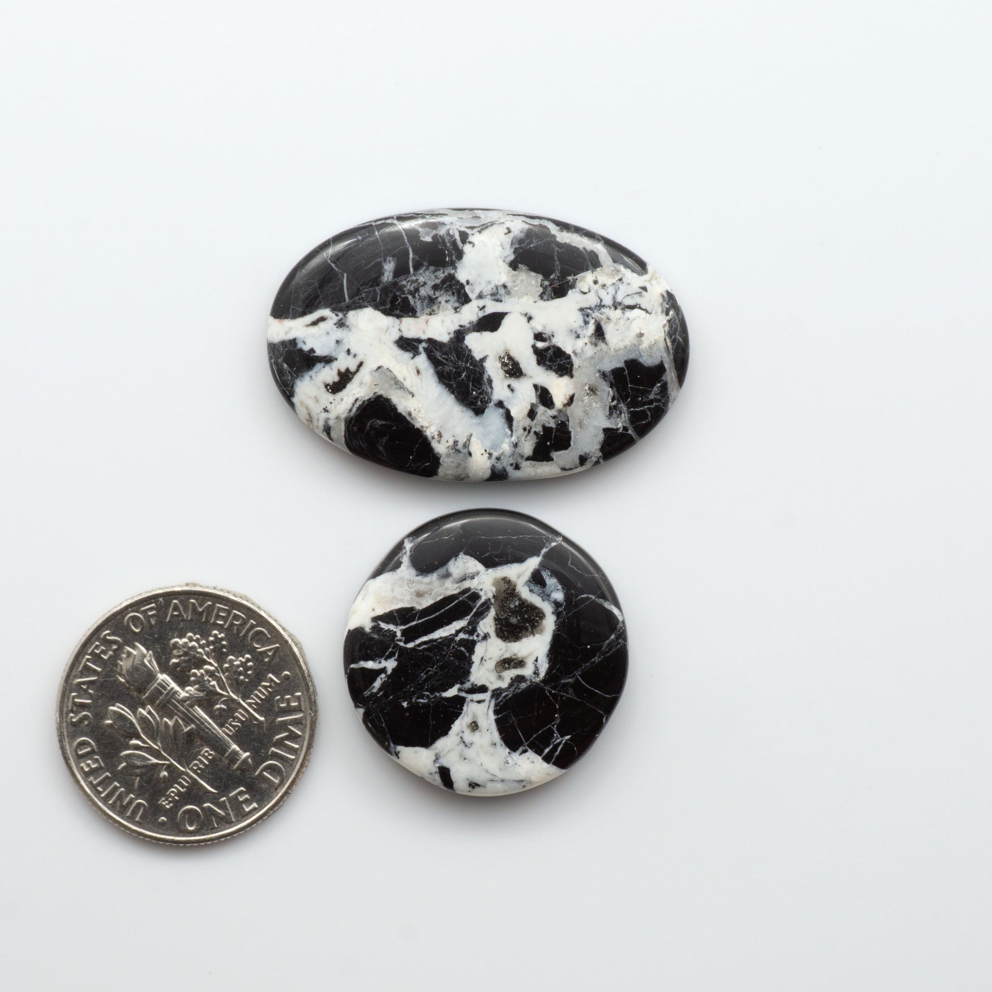 Natural White Buffalo Stone Cabochons are semi-precious gemstones cut into shapes ideal for jewelry-making, making them an excellent choice for artisans.
