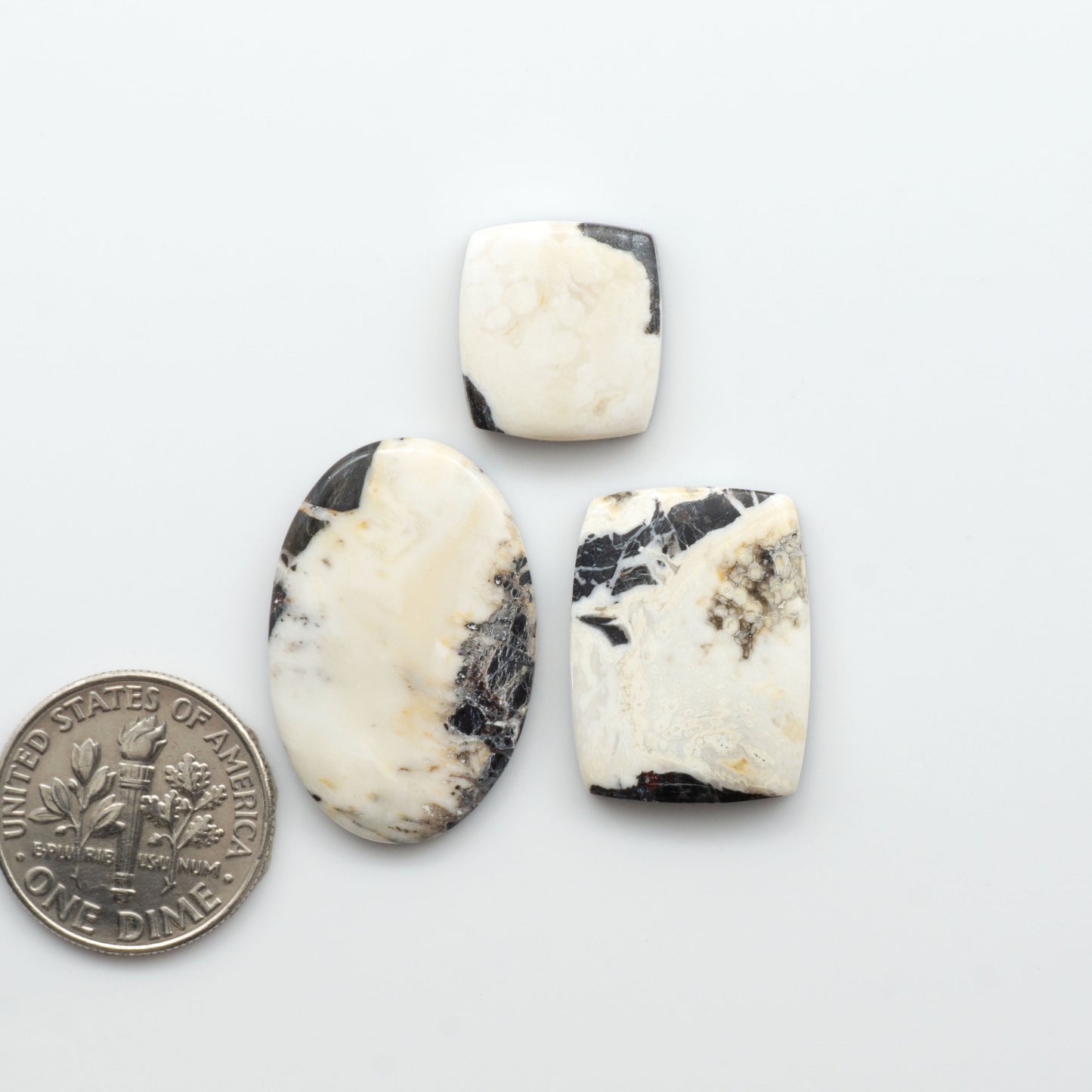 Natural White Buffalo Stone Cabochons are semi-precious gemstones cut into shapes ideal for jewelry-making, crafting and are backed for added strength. 