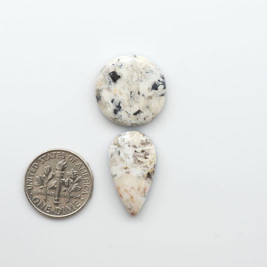 Natural White Buffalo Stone Cabochons are semi-precious gemstones cut into shapes ideal for jewelry-making, crafting and are backed for added strength. 