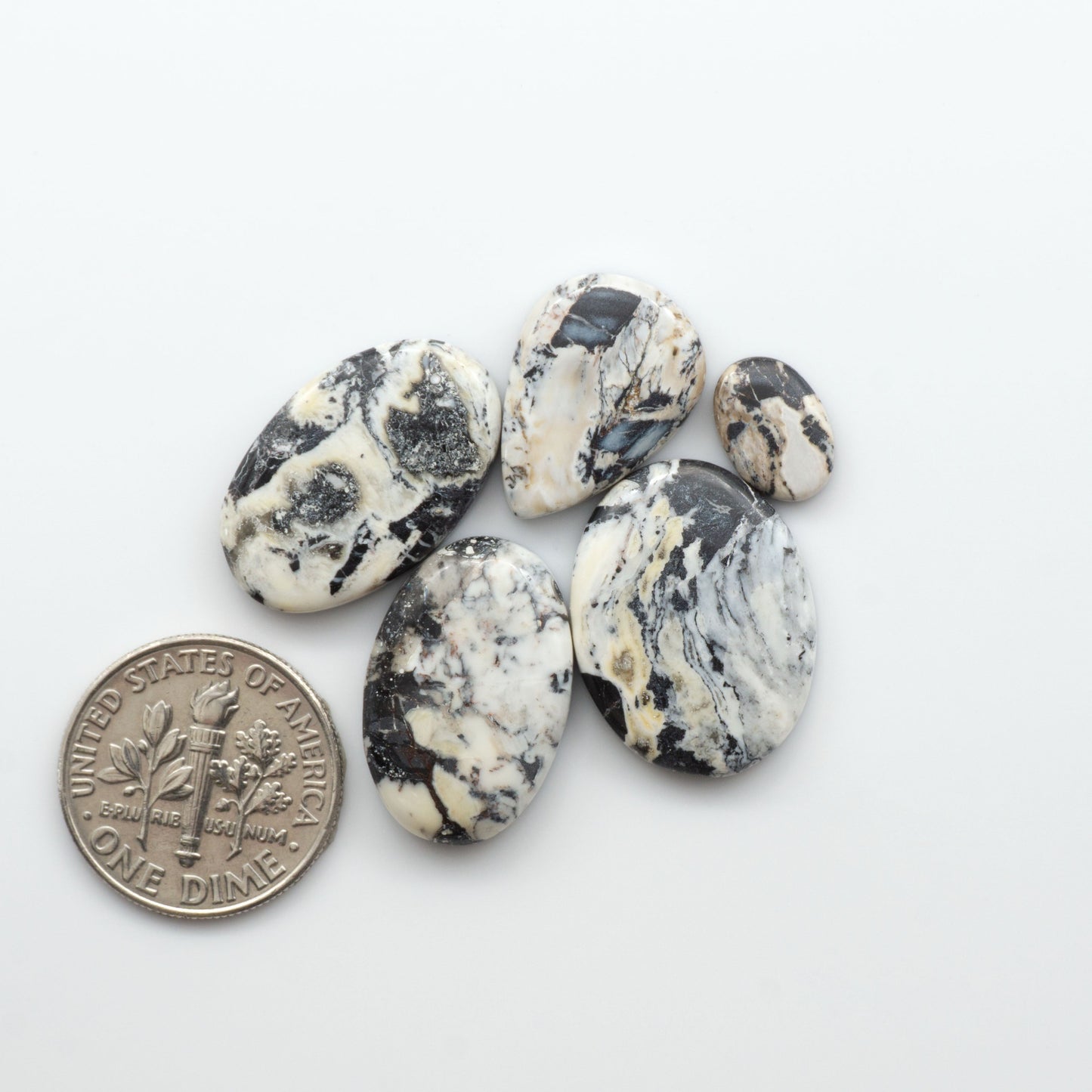 Natural White Buffalo Stone Cabochons are semi-precious gemstones cut into shapes ideal for jewelry-making, crafting and are backed for added strength. 