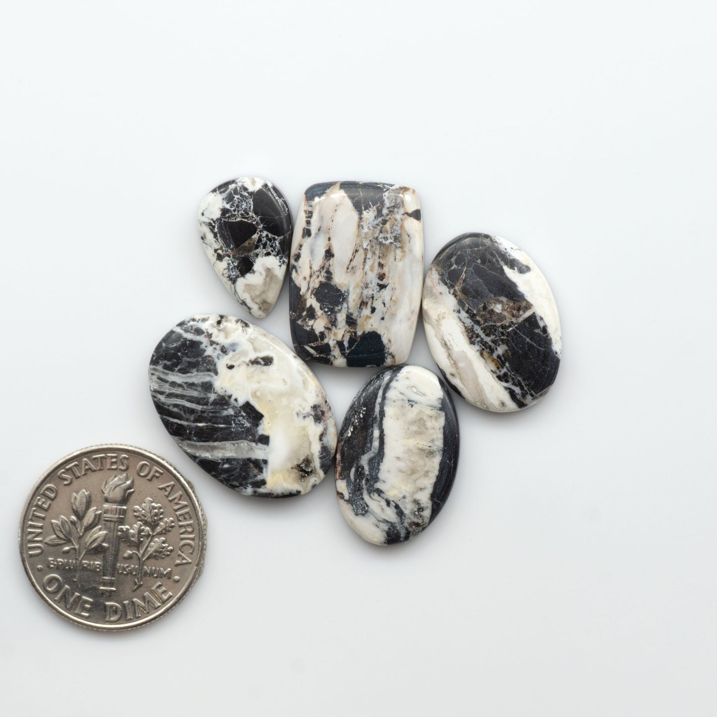 Natural White Buffalo Stone Cabochons are semi-precious gemstones cut into shapes ideal for jewelry-making, crafting and are backed for added strength. 