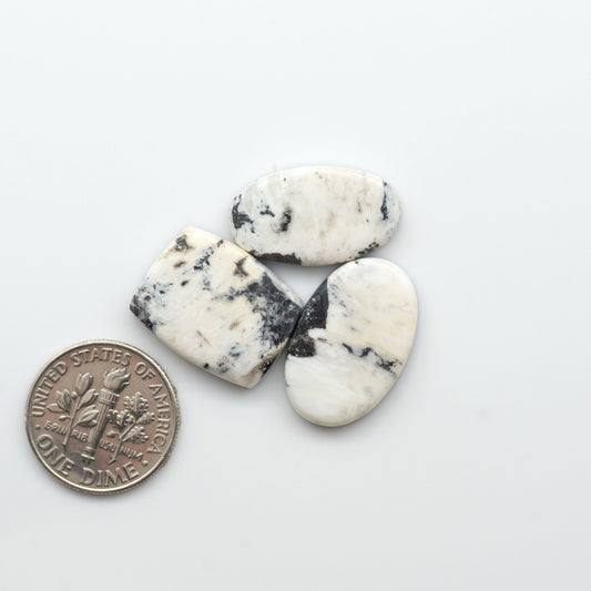 Natural White Buffalo Stone Cabochons are semi-precious gemstones cut into shapes ideal for jewelry-making, crafting and are backed for added strength. 