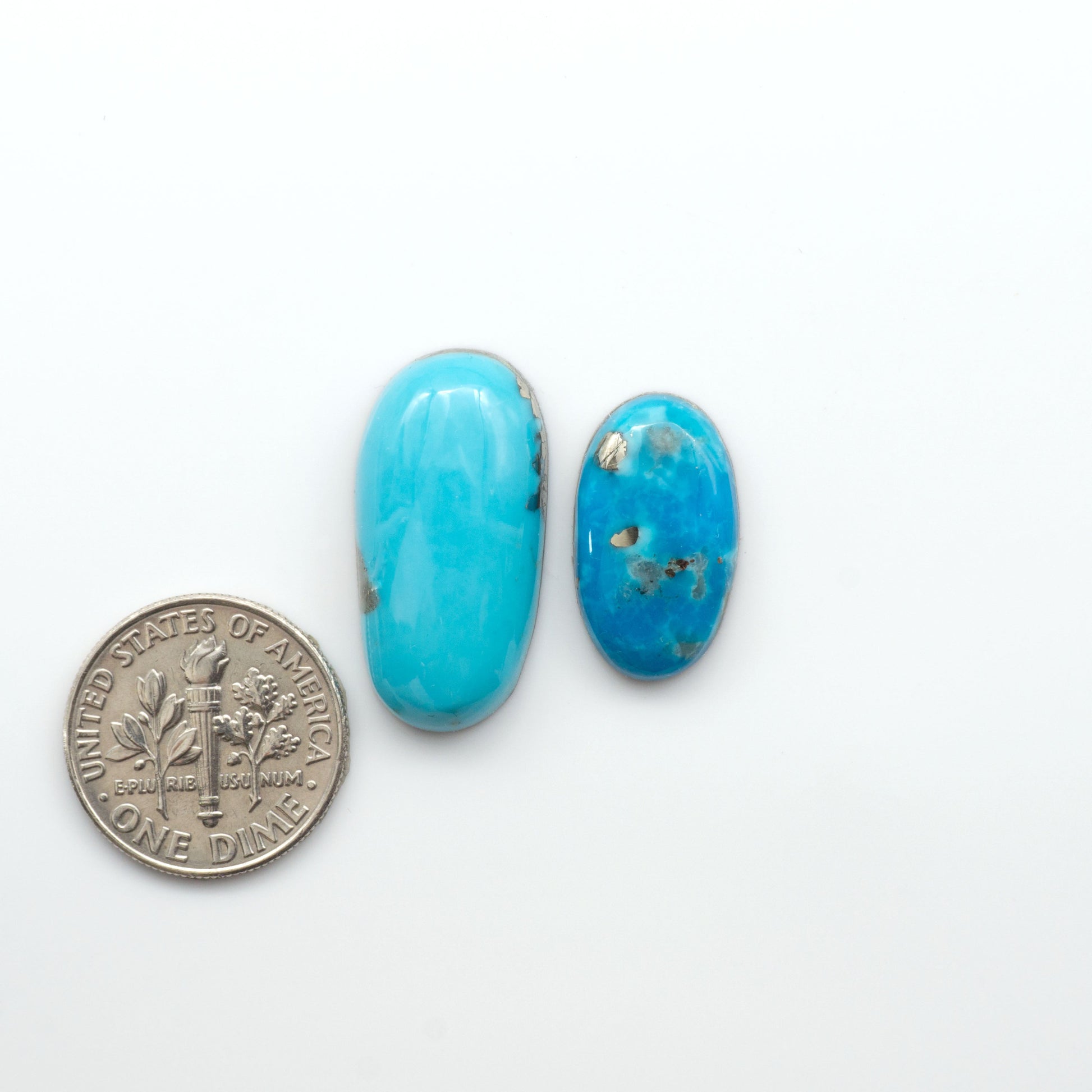 Nacozari turquoise cabochons are striking gemstones known for their vibrant blue to greenish-blue colors and pyrite, these stones are prized in jewelry making.