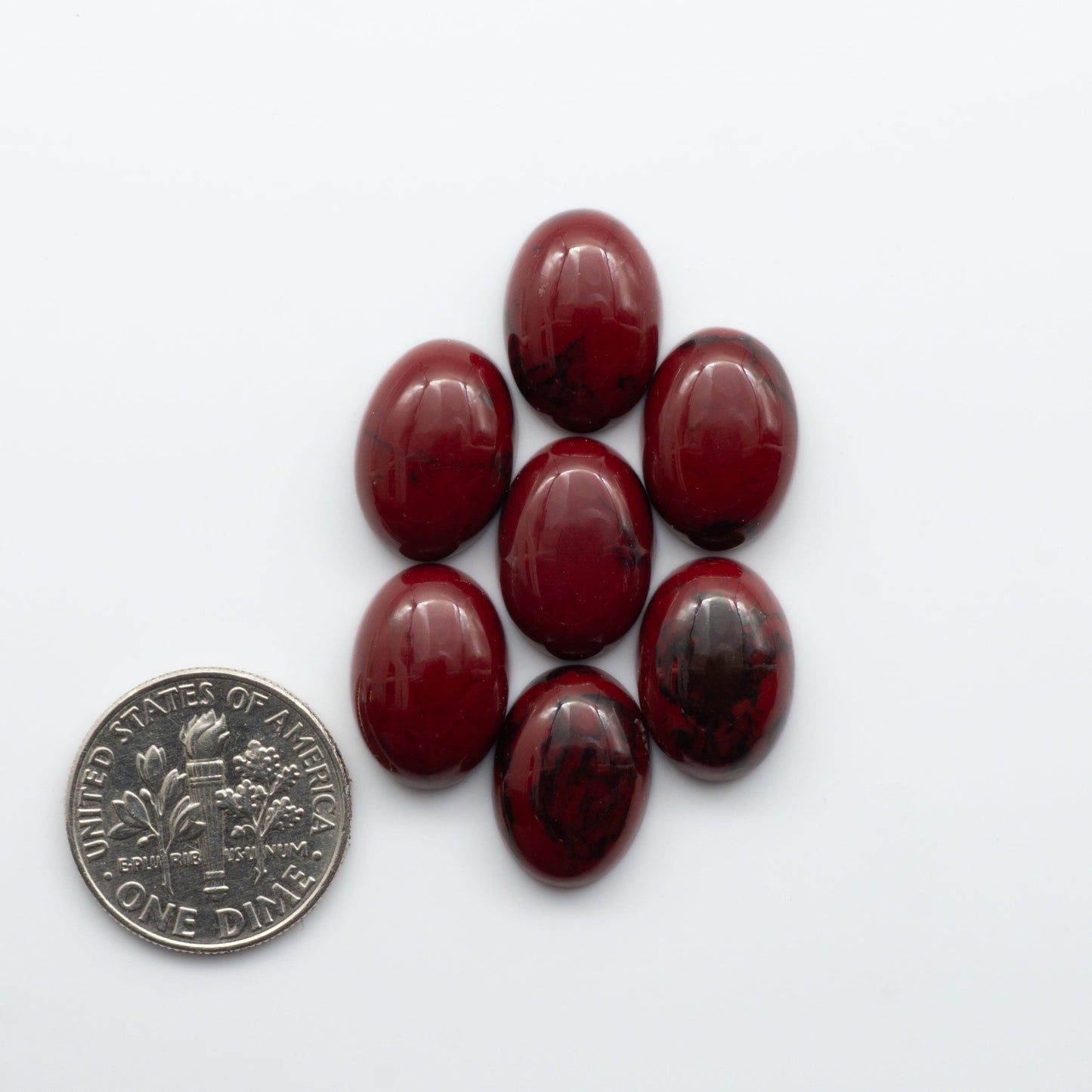 Bloody Bison Jasper is a composite stone with a vibrant red hue and black matrix that creates a strong impression and a touch of opulence to any jewelry piece.