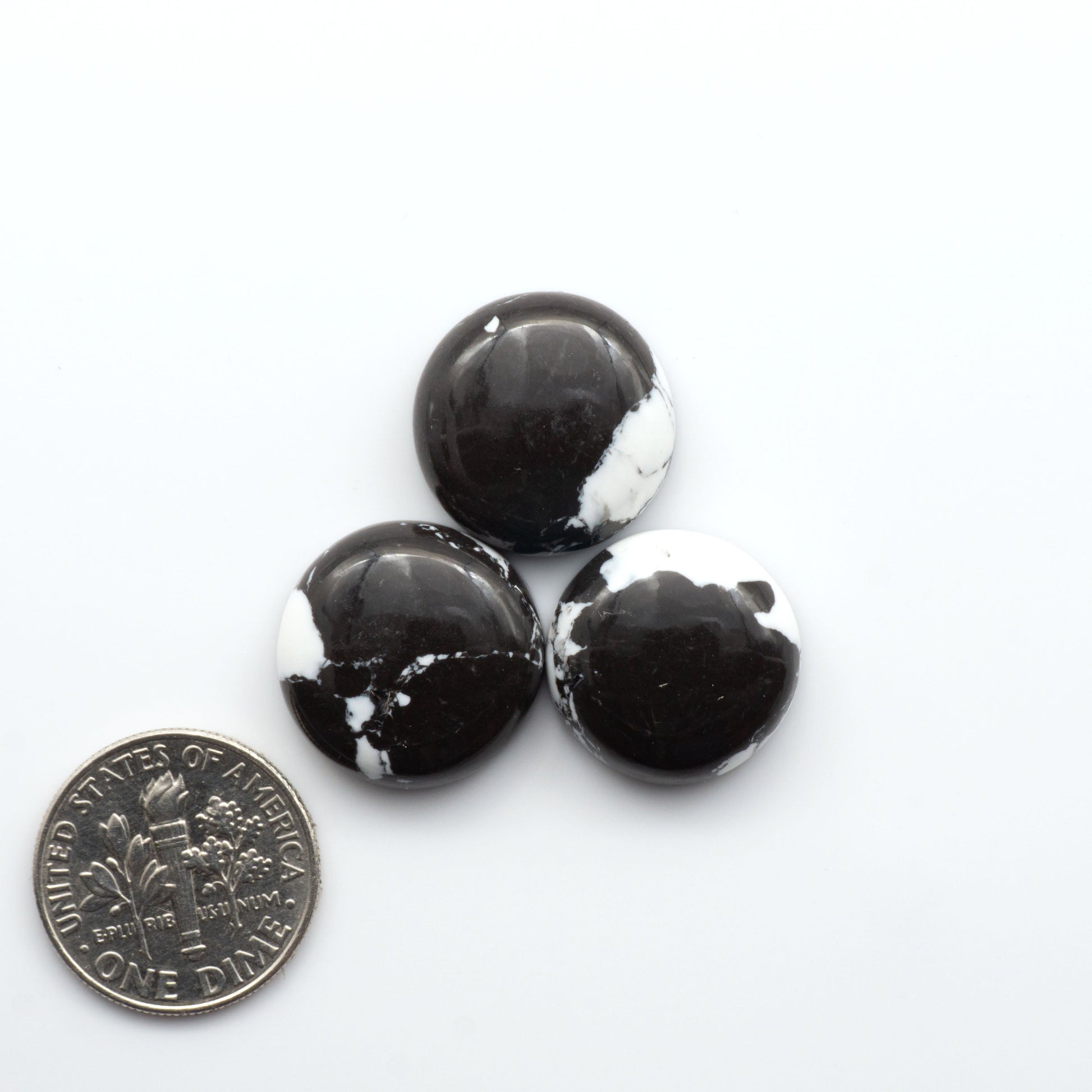 These White Buffalo Cabochons are expertly cut and polished from composite material, resulting in a stunning and long-lasting gemstone.