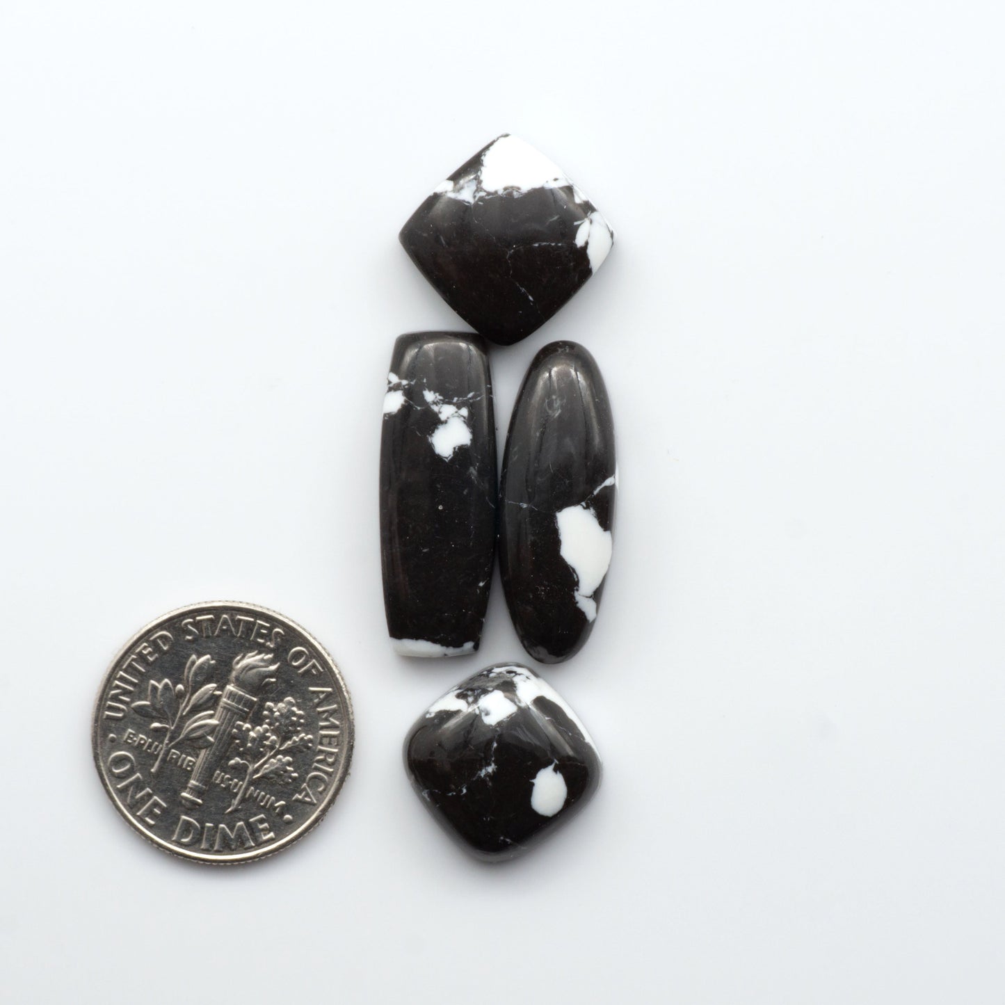 These White Buffalo Cabochons are expertly cut and polished from composite material, resulting in a stunning and long-lasting gemstone.