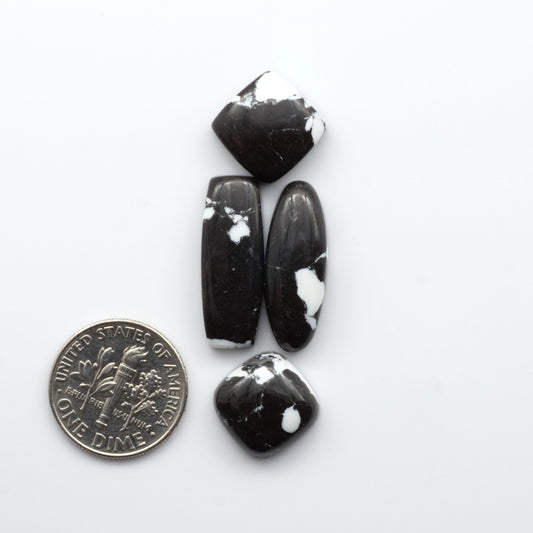 These White Buffalo Cabochons are expertly cut and polished from composite material, resulting in a stunning and long-lasting gemstone.