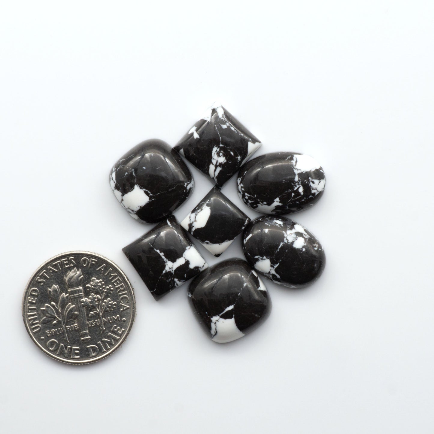 These White Buffalo Cabochons are expertly cut and polished from composite material, resulting in a stunning and long-lasting gemstone.