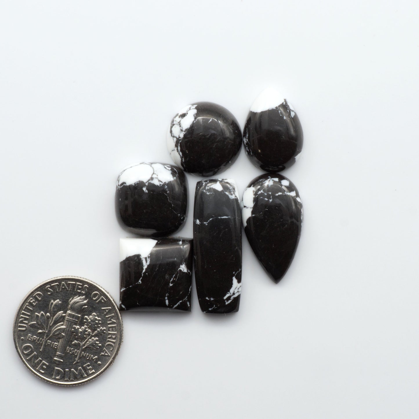 These White Buffalo Cabochons are expertly cut and polished from composite material, resulting in a stunning and long-lasting gemstone.