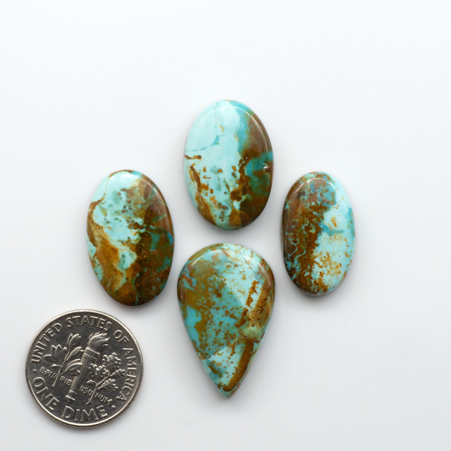Add a touch of beauty to your collection with our stunning Pilot Mountain Turquoise Cabochons. Perfect for jewelry making each piece is truly one-of-a-kind.