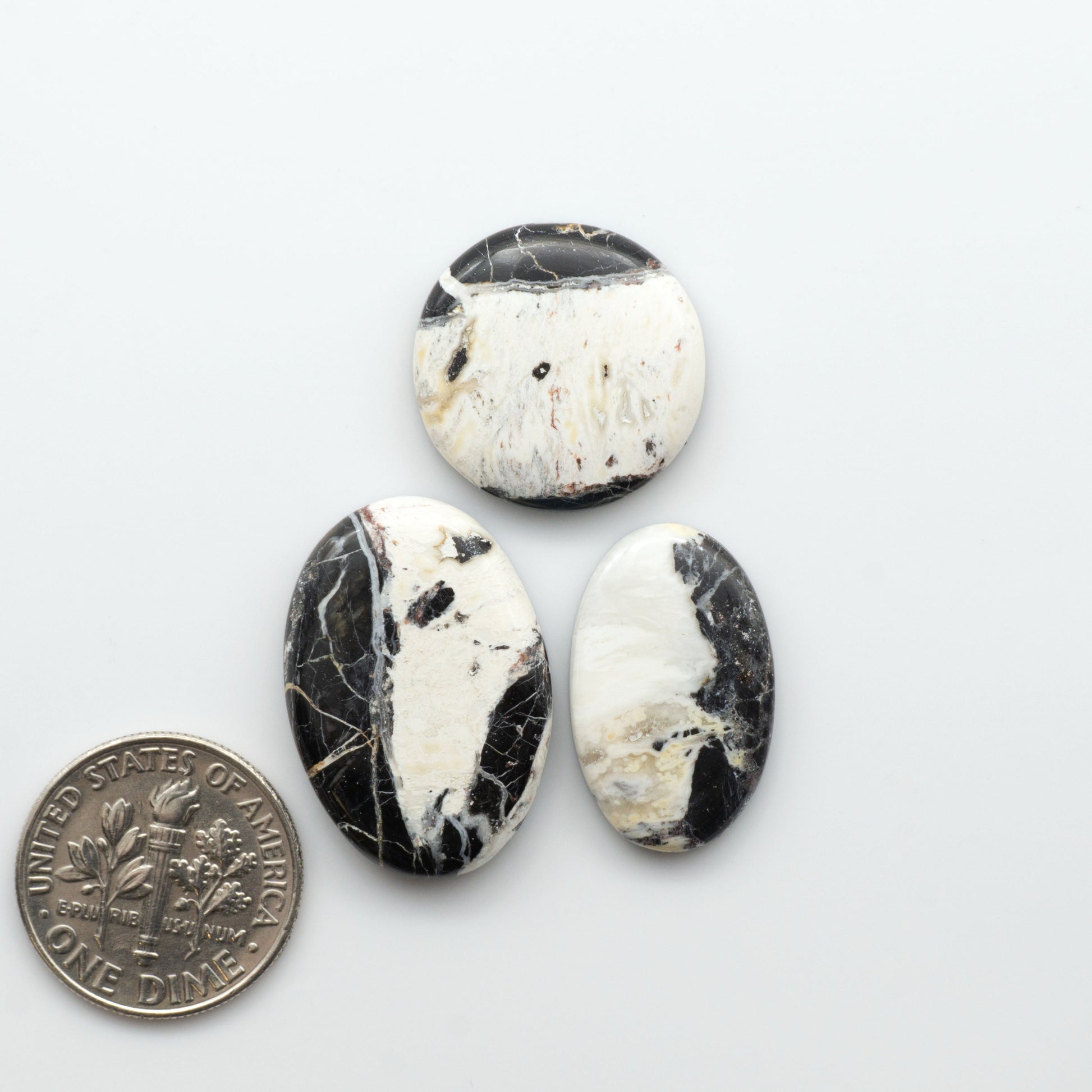 Natural White Buffalo Stone Cabochons are semi-precious gemstones cut into shapes ideal for jewelry-making, making them an excellent choice for artisans.

