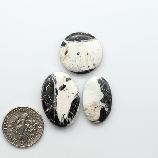 Natural White Buffalo Stone Cabochons are semi-precious gemstones cut into shapes ideal for jewelry-making, making them an excellent choice for artisans.

