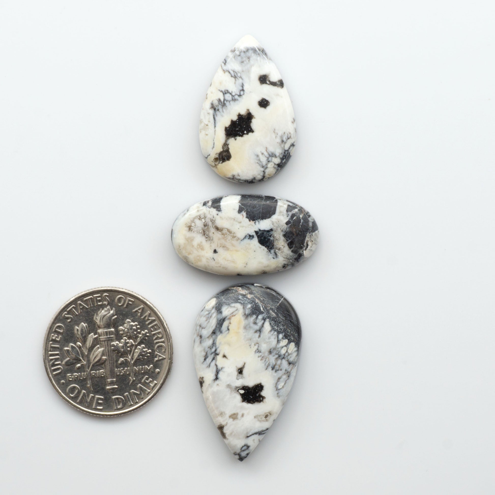 Natural White Buffalo Stone Cabochons are semi-precious gemstones cut into shapes ideal for jewelry-making, making them an excellent choice for artisans.

