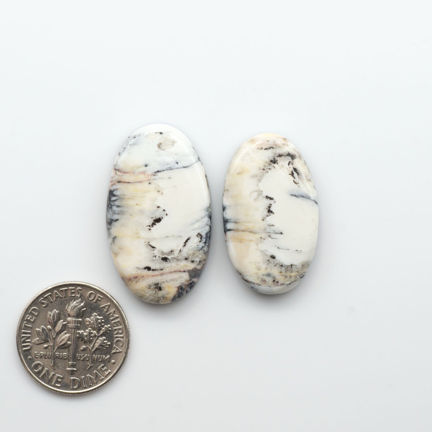 Natural White Buffalo Stone Cabochons are semi-precious gemstones cut into shapes ideal for jewelry-making, making them an excellent choice for artisans.

