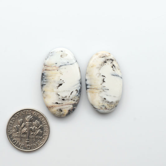 Natural White Buffalo Stone Cabochons are semi-precious gemstones cut into shapes ideal for jewelry-making, making them an excellent choice for artisans.

